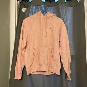 A sweatshirt in the size small in the color Salmon